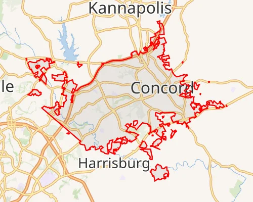 A regional road map highlighting the city boundaries of Concord, North Carolina in a red outline, positioned between Kannapolis to the north and Harrisburg to the south.